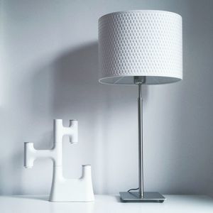 Close-up of table lamp against the wall