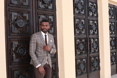 Businessman standing outside building