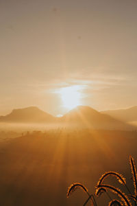 Scenic view of mountains against sky during sunset