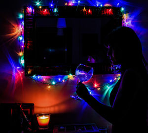 Blurred motion of woman at night