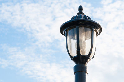 Low angle view of street light against sky