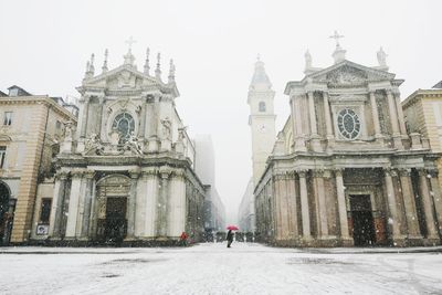 People walking in temple during winter