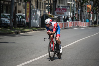 Man riding bicycle on road