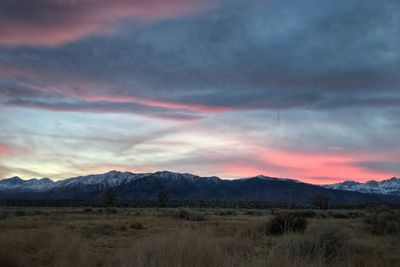 Scenic view of field against sky during sunset