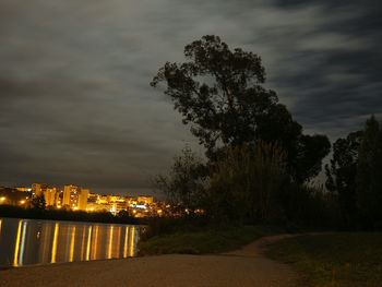 Scenic view of river against cloudy sky