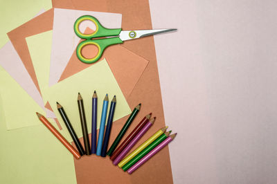 High angle view of multi colored pencils on table