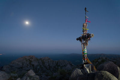 Scenic view of rock against sky at night