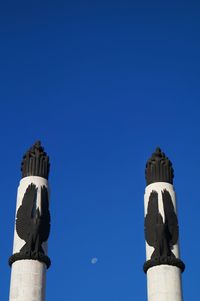 Low angle view of built structure against clear blue sky