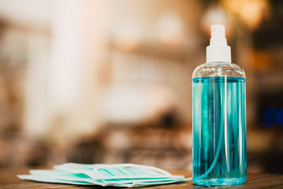 Close-up of glass bottle on table