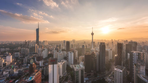 Cityscape against sky during sunset