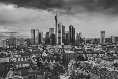 Aerial view of modern buildings in city against sky