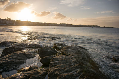 Scenic view of sea at sunset