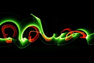 Multi colored light painting against black background