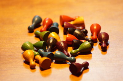 Close-up of colorful tokens on wood