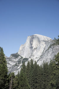 Scenic view of mountains against clear blue sky