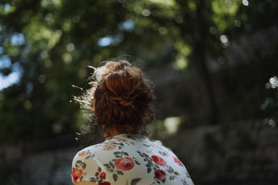 Rear view of woman looking at forest