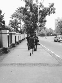 Woman walking on road