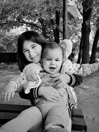 Sisters sitting outdoors