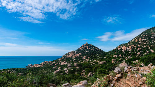 Scenic view of sea against blue sky