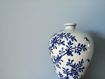 Close-up of vase against white background