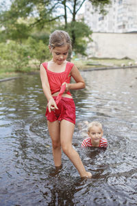 Portrait of mother and daughter in water