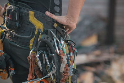 Cropped hand of man riding horse