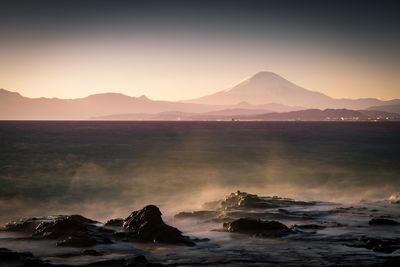 Scenic view of mountains against sky during sunset