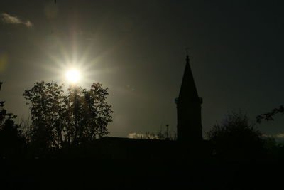 Low angle view of built structure at sunset