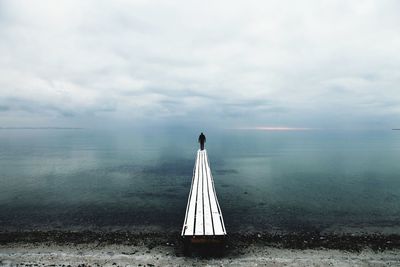 Scenic view of sea against cloudy sky