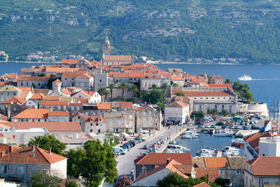 High angle view of townscape by sea