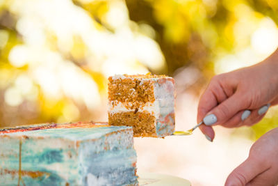 Close-up of hand holding ice cream