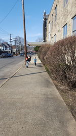 Full length of woman walking on road