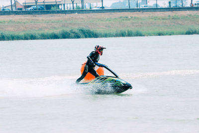 Man riding horse in boat