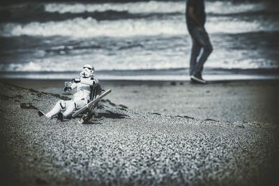 Close-up of toy on sand at beach