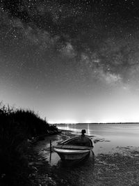 Scenic view of sea against sky at night