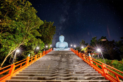 Low angle view of man standing on staircase