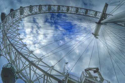 Low angle view of ferris wheel against sky