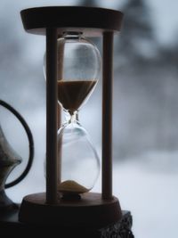 Close-up of clock on sand