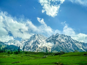 Scenic view of snowcapped mountains against sky