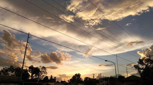 Low angle view of silhouette trees against sky during sunset