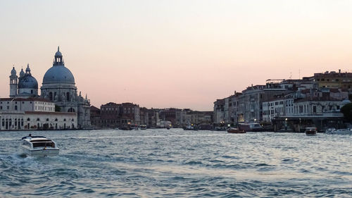 View of buildings in city against clear sky