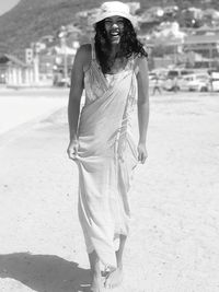 Portrait of young woman standing outdoors