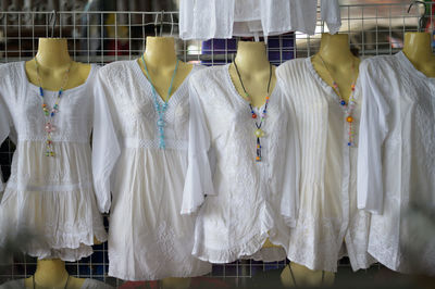 Clothes hanging in store for sale at market