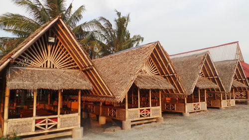 Built structure on beach against sky