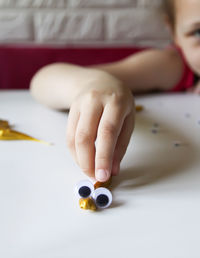 Close-up of girl drawing on table