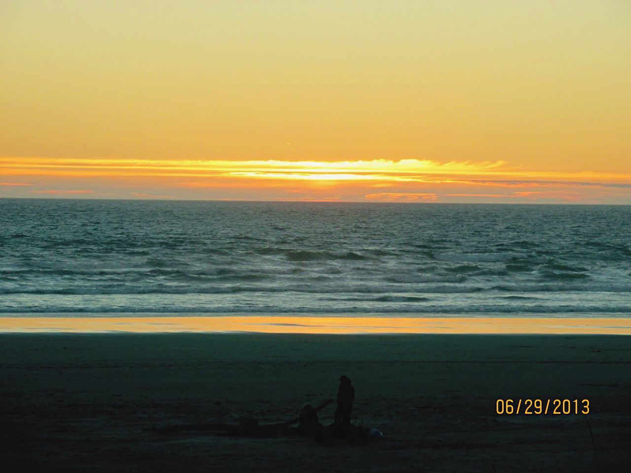 SCENIC VIEW OF SEA AT SUNSET