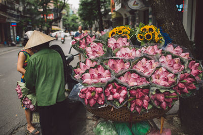 Close-up of pink flowers in market for sale