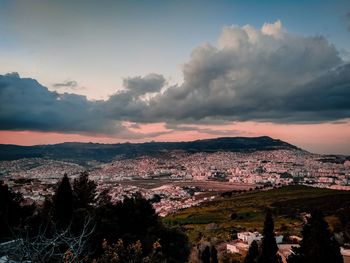 High angle shot of townscape against sky at sunset