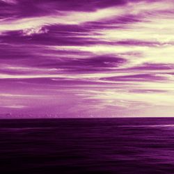 Scenic view of sea against sky at dusk
