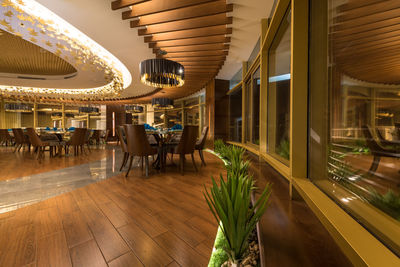 Empty chairs and tables in restaurant